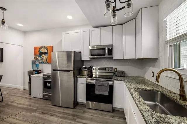 a view of hallway with wooden floor