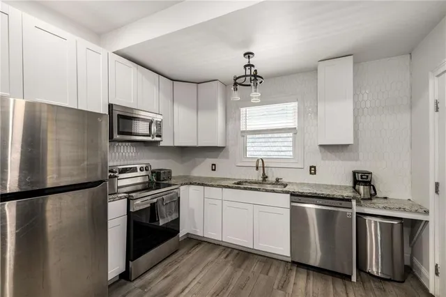 a bedroom with a bed table and a window