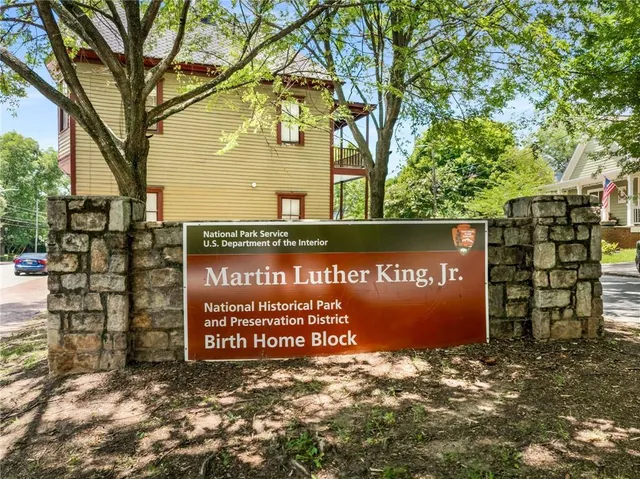 a view of an outdoor space with furniture and umbrella
