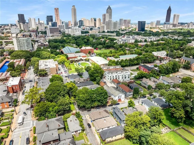 a roof deck with outdoor seating and water view