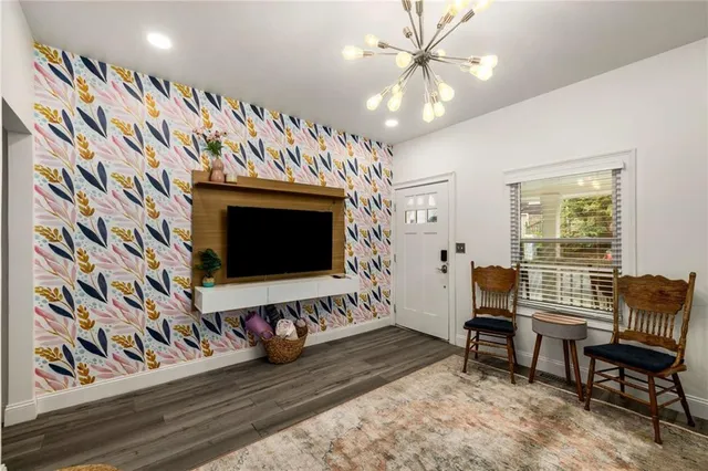 a kitchen with stainless steel appliances granite countertop a refrigerator stove and sink