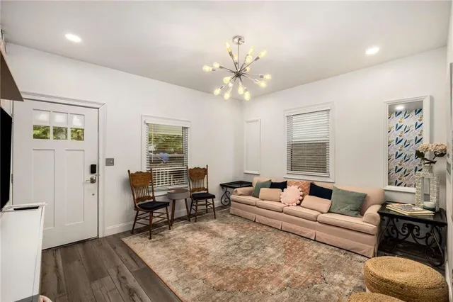 a kitchen with stainless steel appliances a refrigerator sink and microwave