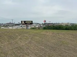 a view of a park with welcome board