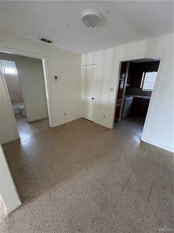 512 Gastel Circle, Unit 5 Edinburg, TX 78539 - Photo 4 of 10 a view of an empty room with a closet