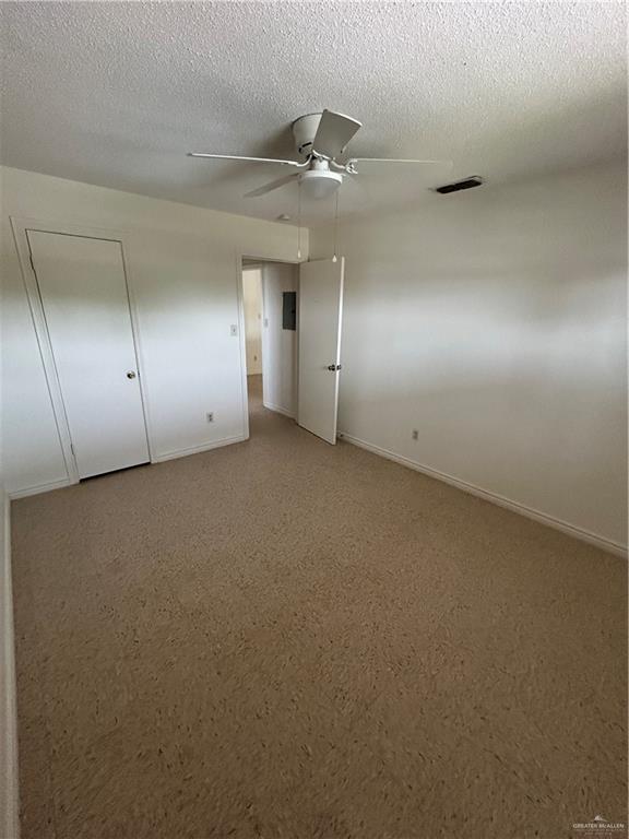 512 Gastel Circle, Unit 5 Edinburg, TX 78539 - Photo 7 of 10 an empty room with a ceiling fan and window