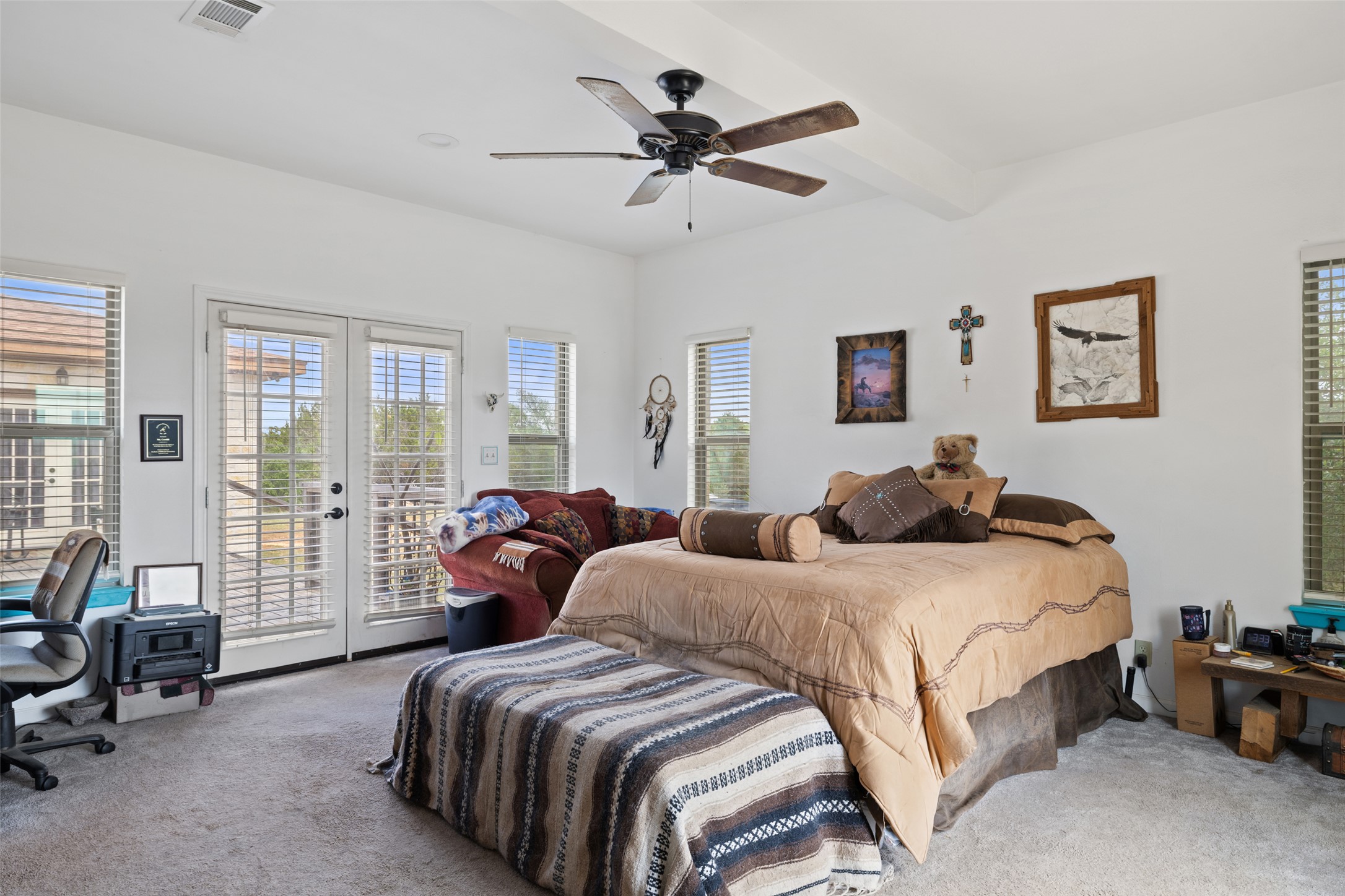 2966 Rm 165 Dripping Springs Dripping Springs, TX 78620 - Photo 21 of 23 Spacious room with tray ceiling and ceiling fan