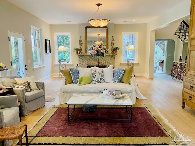 a front view of a house with swimming pool and yard