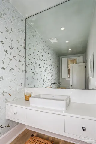 a front view of a house with swimming pool having outdoor seating