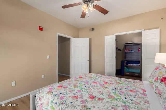 a room with a closet and wooden floor