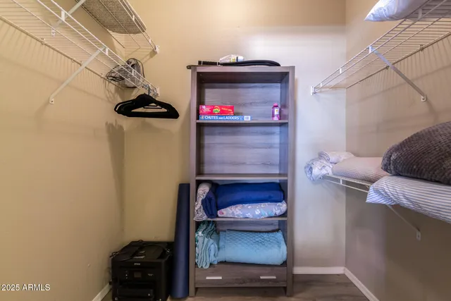 a bathroom with a toilet a sink and a mirror