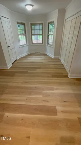 a bathroom with a double vanity sink a mirror and a bathtub