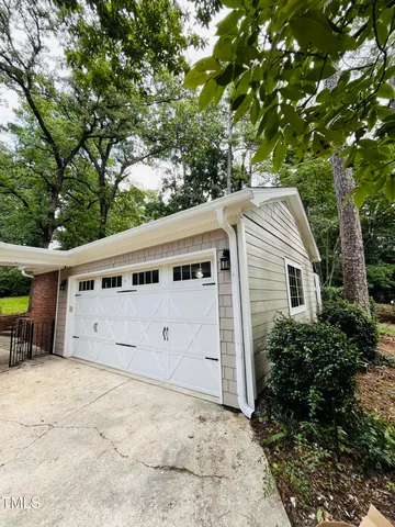 a kitchen with green cabinets and a wooden floor