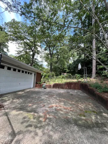 a view of a swimming pool with an outdoor space and seating area