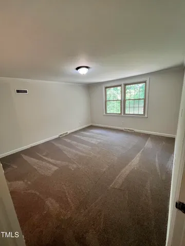a bathroom with a double vanity sink toilet and shower
