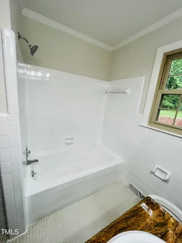 a bathroom with a sink and a bathtub