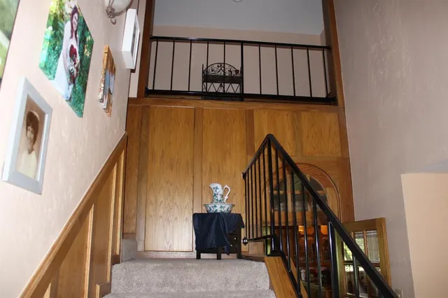 a view of stairs with wooden floor