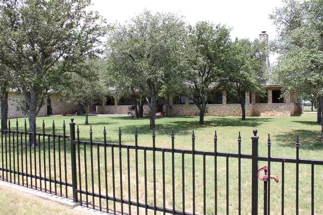 a view of a park with large trees