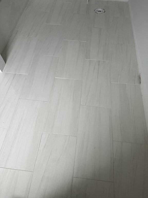 249 Groton Road, Unit 2 Chelmsford, MA 01863 - Photo 5 of 23 close up of a white marble wall