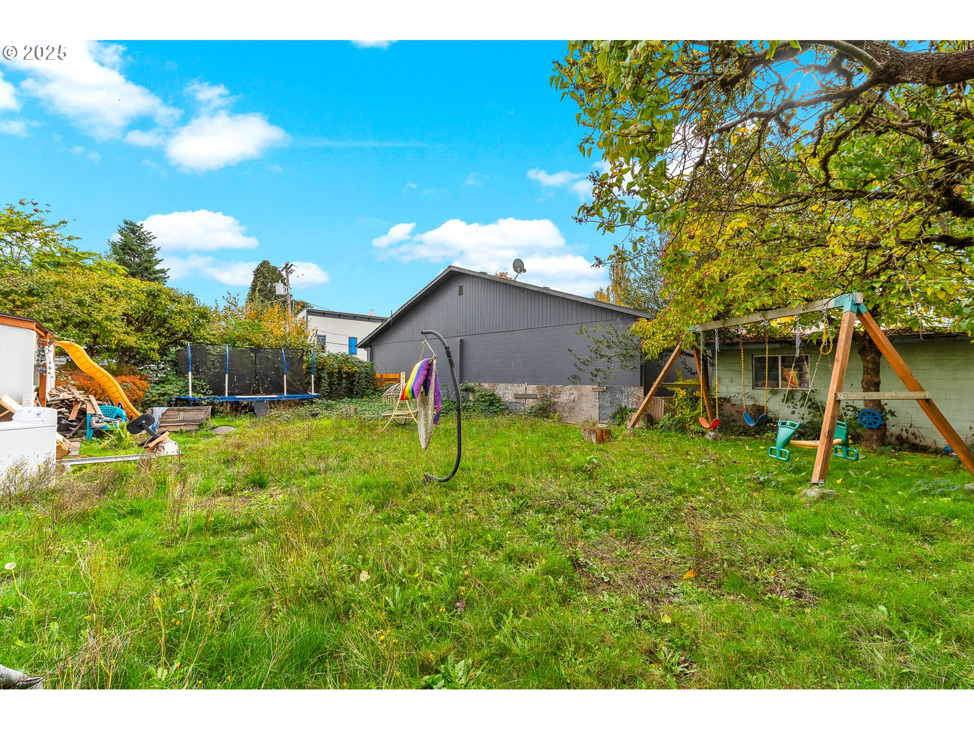 2026 C Street Washougal, WA 98671 - Photo 16 of 36 a backyard of a house with table and chairs