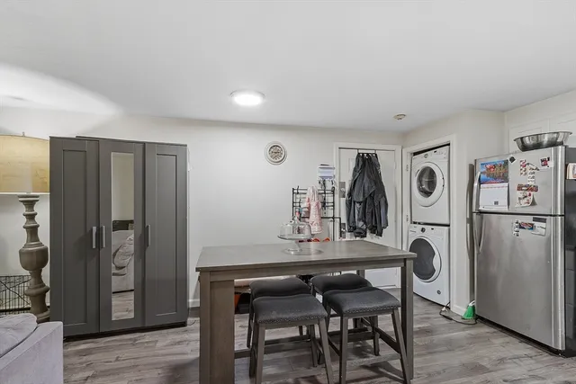 a view of a dining room with furniture and window