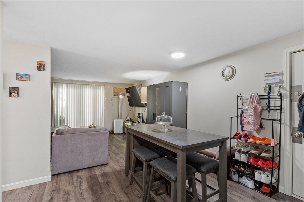 10 Dryden Street, Unit 7 Worcester, MA 01605 - Photo 7 of 24 a view of a dining room with furniture and wooden floor