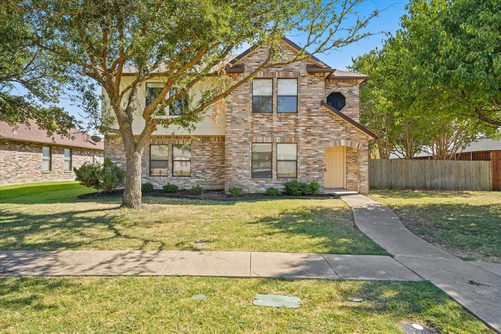 12009 Rosedown Lane Frisco, TX 75035 - Photo 1 of 1 a front view of a house with a yard