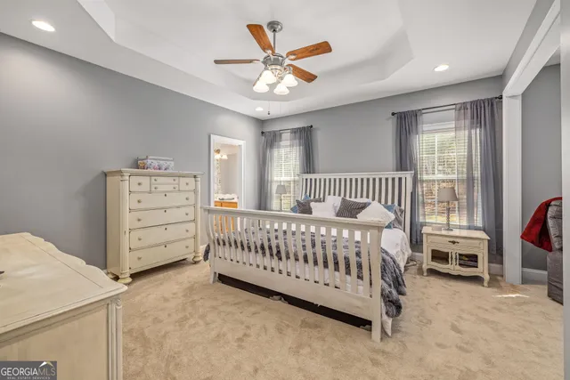 a bedroom with a bed and a chair