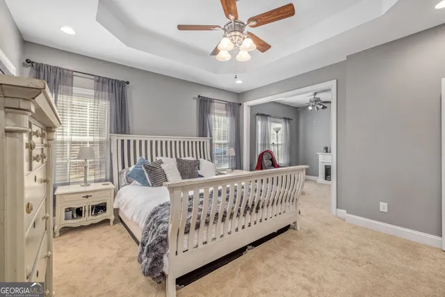 a bed room with a bed and a window