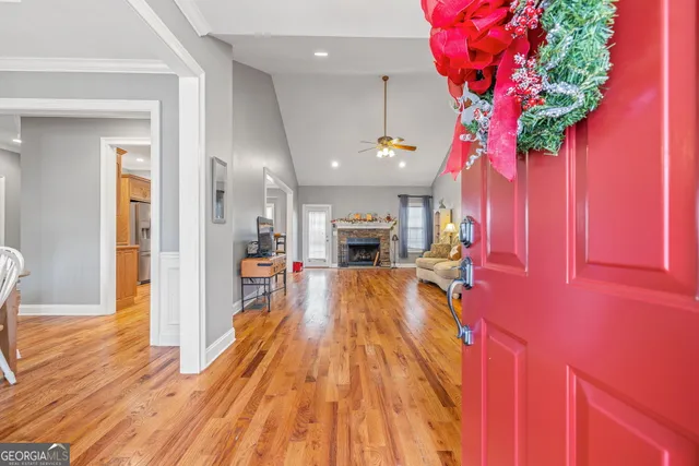a view of a living room with a fireplace furniture and a potted plant