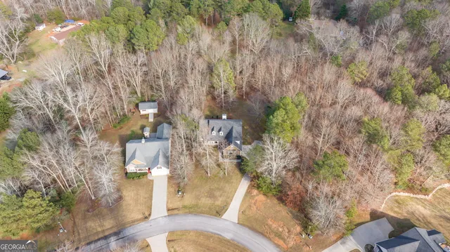 an aerial view of residential house with outdoor space and swimming pool