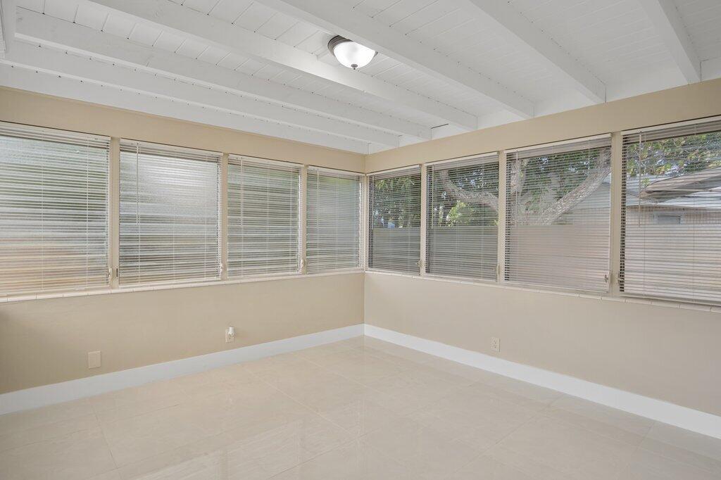 591 Oleander Road Lake Worth, FL 33462 - Photo 23 of 43 a view of an empty room with a window