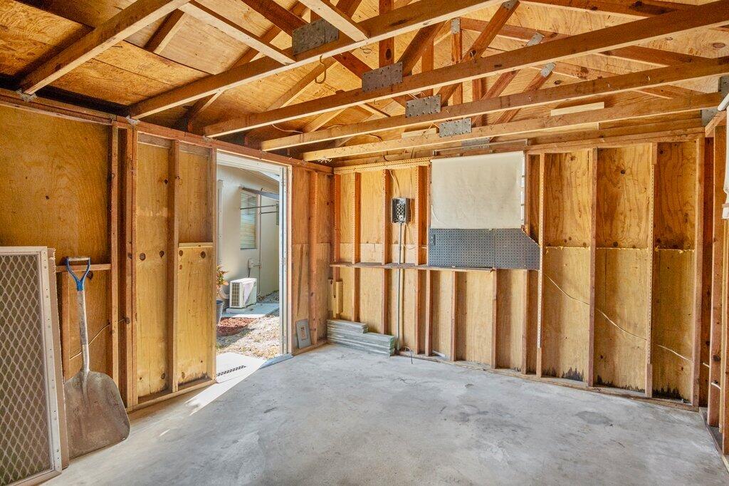 591 Oleander Road Lake Worth, FL 33462 - Photo 30 of 43 a view of a room with wooden walls