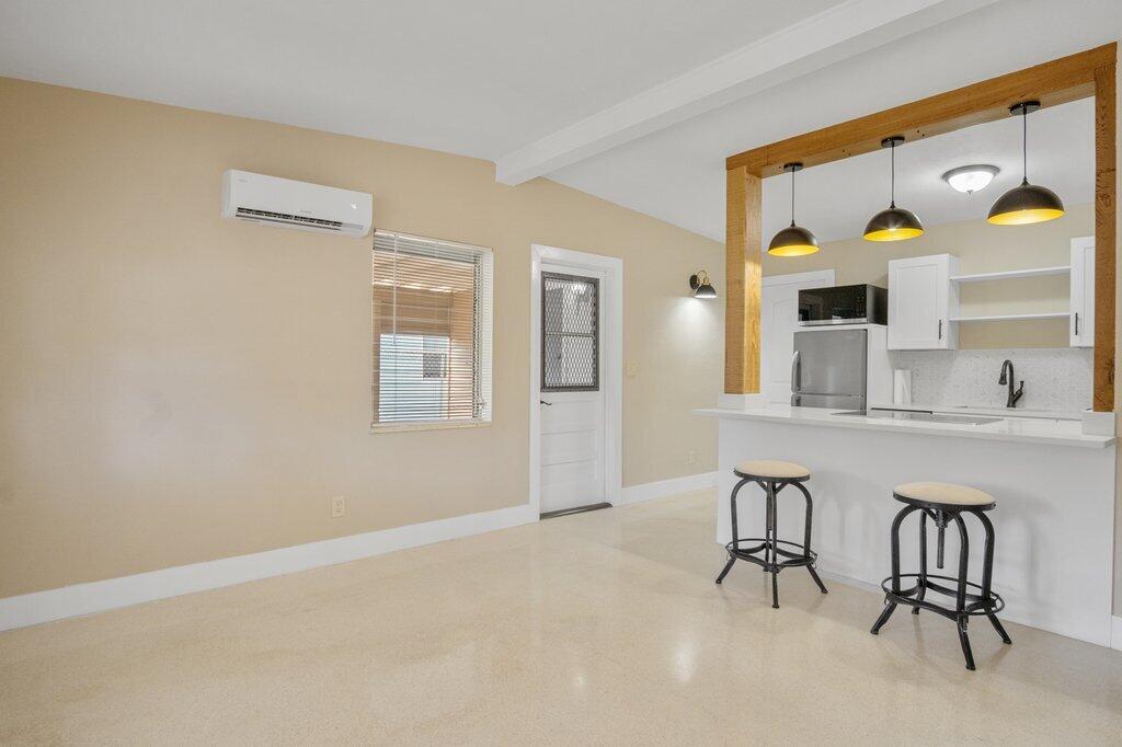591 Oleander Road Lake Worth, FL 33462 - Photo 8 of 43 a dining room with furniture and window