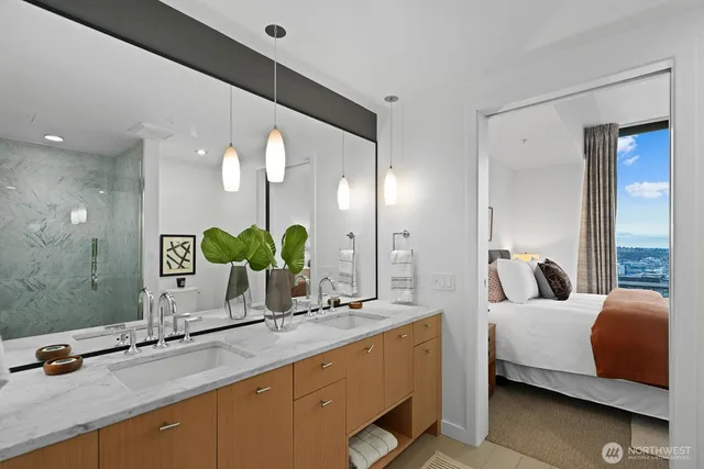 a bathroom with a double vanity sink and a mirror