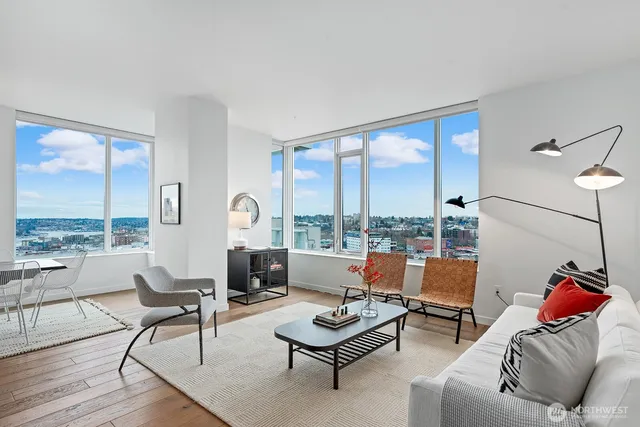 a living room with furniture and a large window