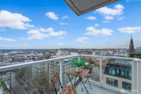 a view of a chairs and table in a balcony