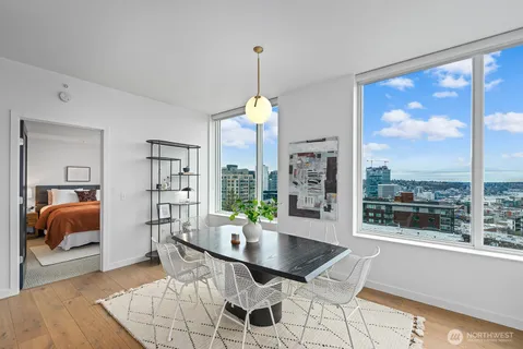 a dining room with furniture and window