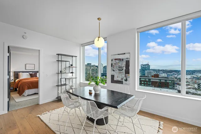 a dining room with furniture and window