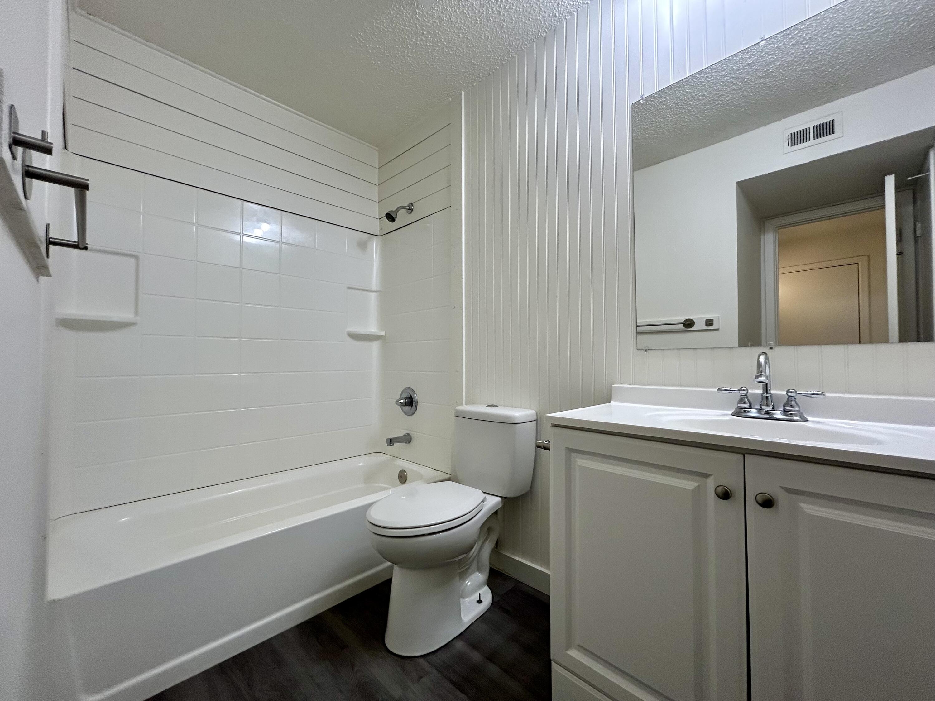 3204 Salisbury Avenue, Unit C Lubbock, TX 79410 - Photo 6 of 7 a bathroom with a sink toilet and shower