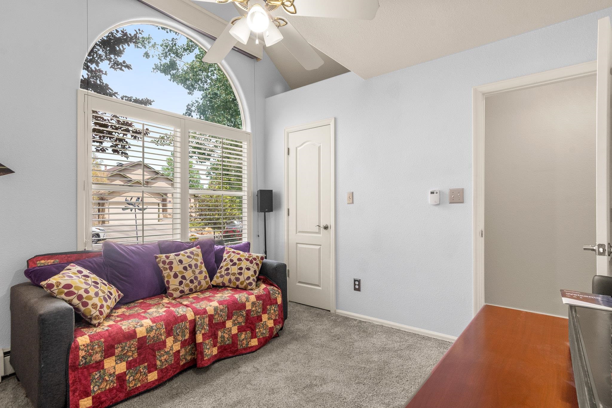 398 Butte Court Grand Junction, CO 81507 - Photo 16 of 33 a living room with furniture and a large window