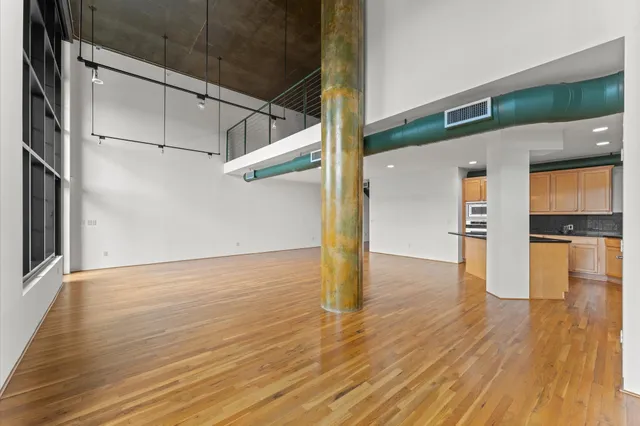 a kitchen with stainless steel appliances a refrigerator and a stove top oven