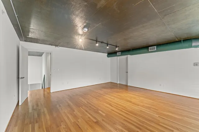 a kitchen with a refrigerator and window