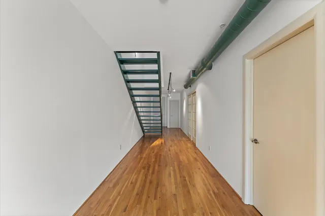 a view of entryway with wooden floor
