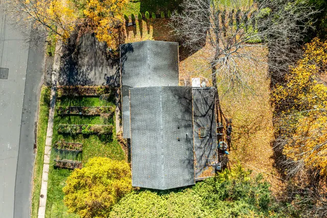 an aerial view of residential houses with outdoor space