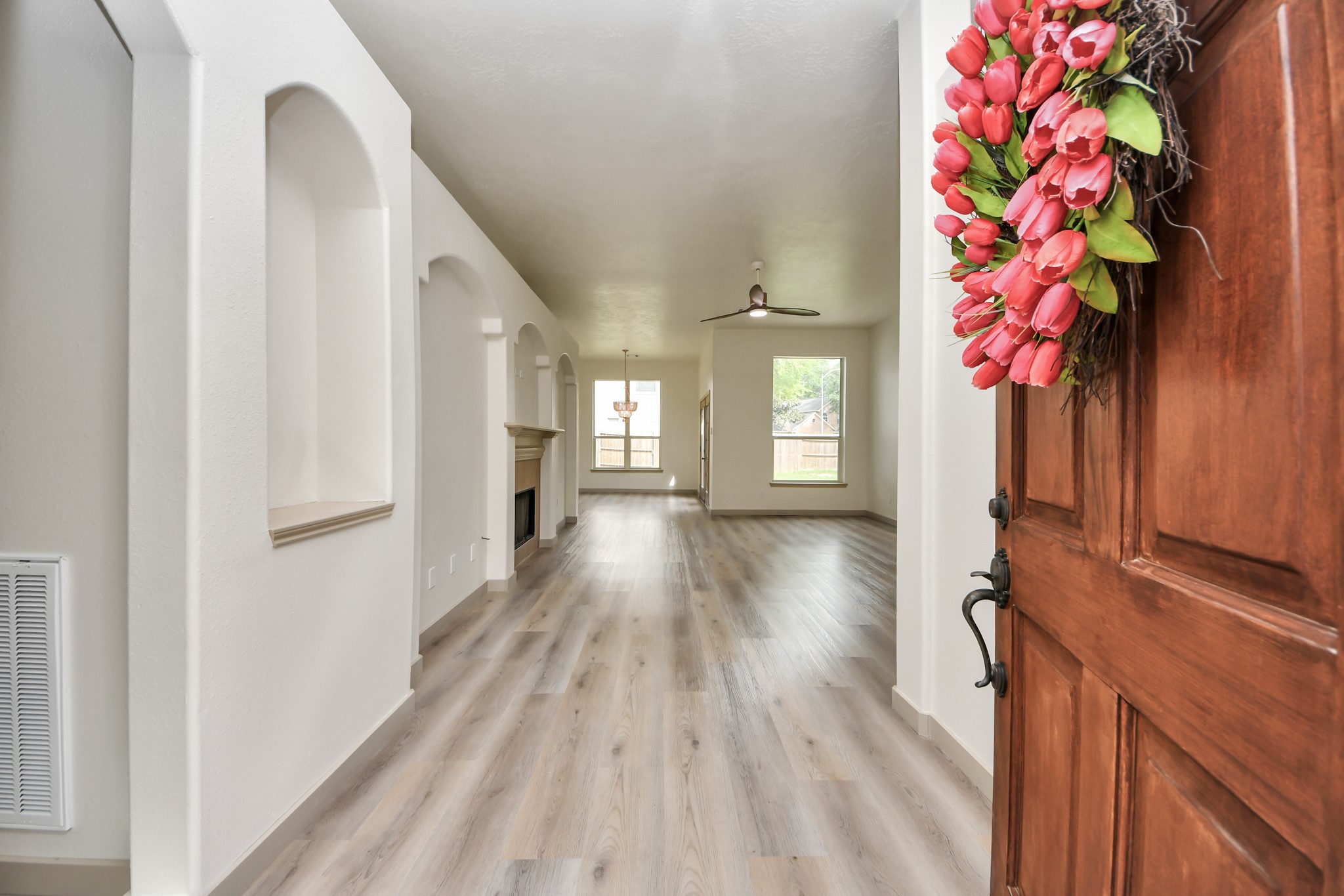 14423 Gadwall Court Houston, TX 77044 - Photo 8 of 42 a view of entryway with wooden floor