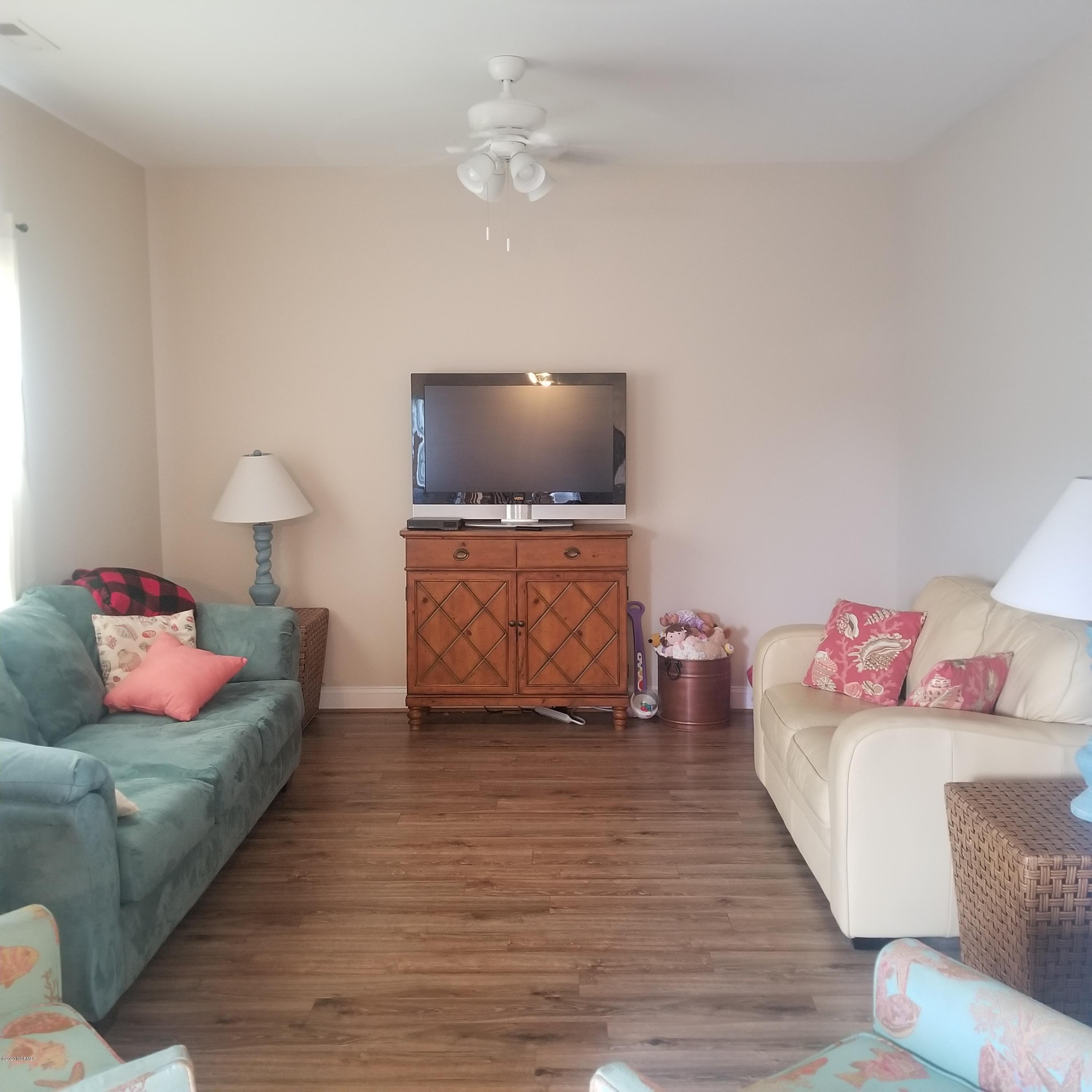 2210 Mayberry Loop Road, Unit B Morehead City, NC 28557 - Photo 14 of 16 living area with laminate flooring