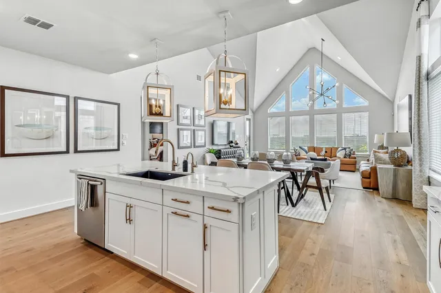 a kitchen with stainless steel appliances granite countertop a stove and a refrigerator