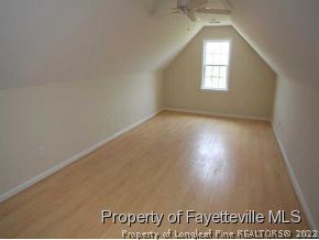 3605 Old Stage Road North Angier, NC 27501 - Photo 8 of 12 an empty room with wooden floor and windows
