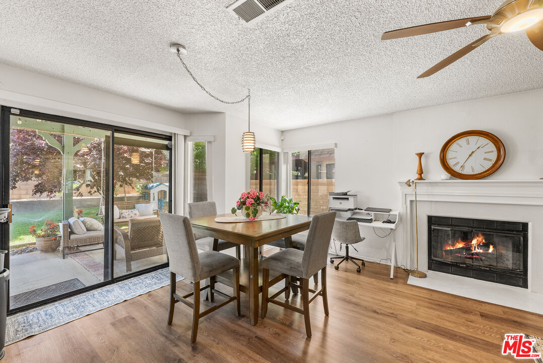 43258 33rd Street West Lancaster, CA 93536 - Photo 15 of 38 a dining room with furniture window and wooden floor