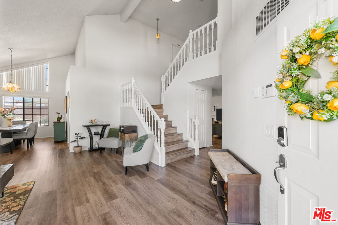 43258 33rd Street West Lancaster, CA 93536 - Photo 3 of 38 a living room with furniture and a wooden floor